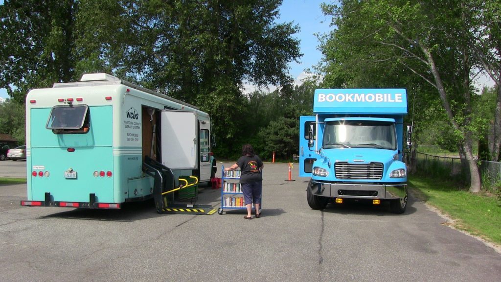 Moving books to the new bookmobile.