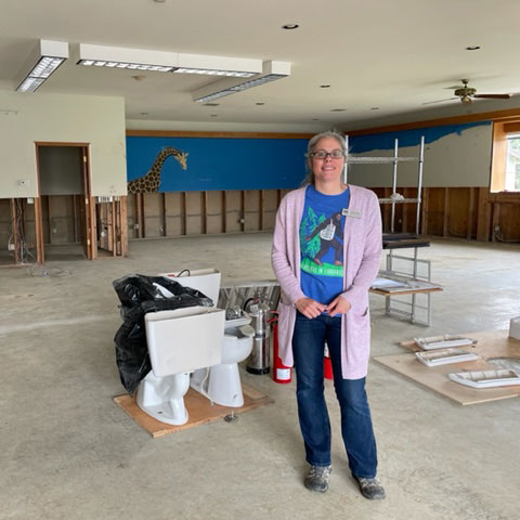 Cayla standing in Sumas Library during flood repairs