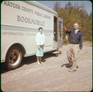 Old photo of bookmobile with woman and man