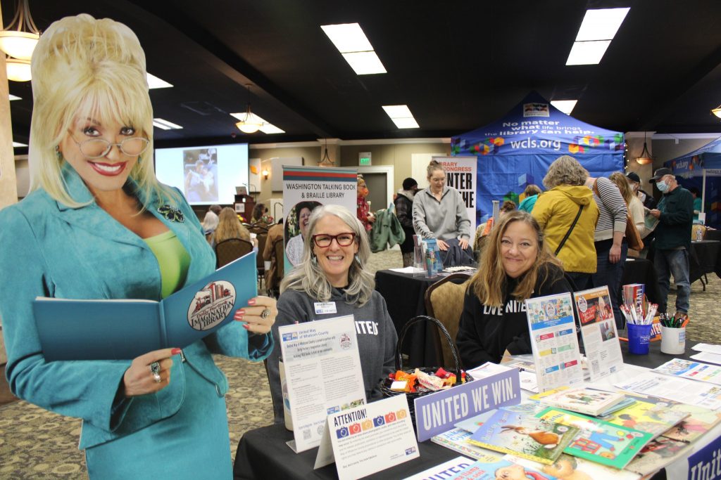 United Way booth with cardboard cutout of Dolly Parton at Open Book Festival