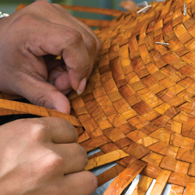 hands weaving cedar braids