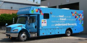 Bookmobile with quotation from Nelson Mandela: "When we read we are able to travel to many places, meet many people, and understand the world."