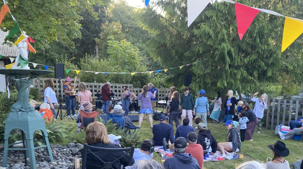 Band playing in front of crowd at Island Library