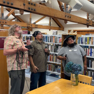 Jason LaClaire, Marty Jimmy and Neil McKay in the Deming Library