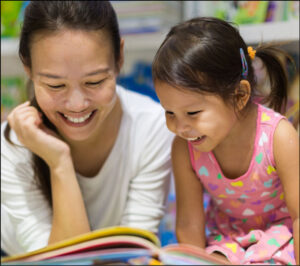 Mother and child reading a book