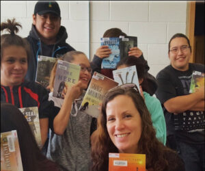Young people holding books